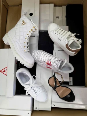 The photo shows a package with footwear in the category BS.