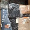 The photo shows a package with clothing in the category AM.