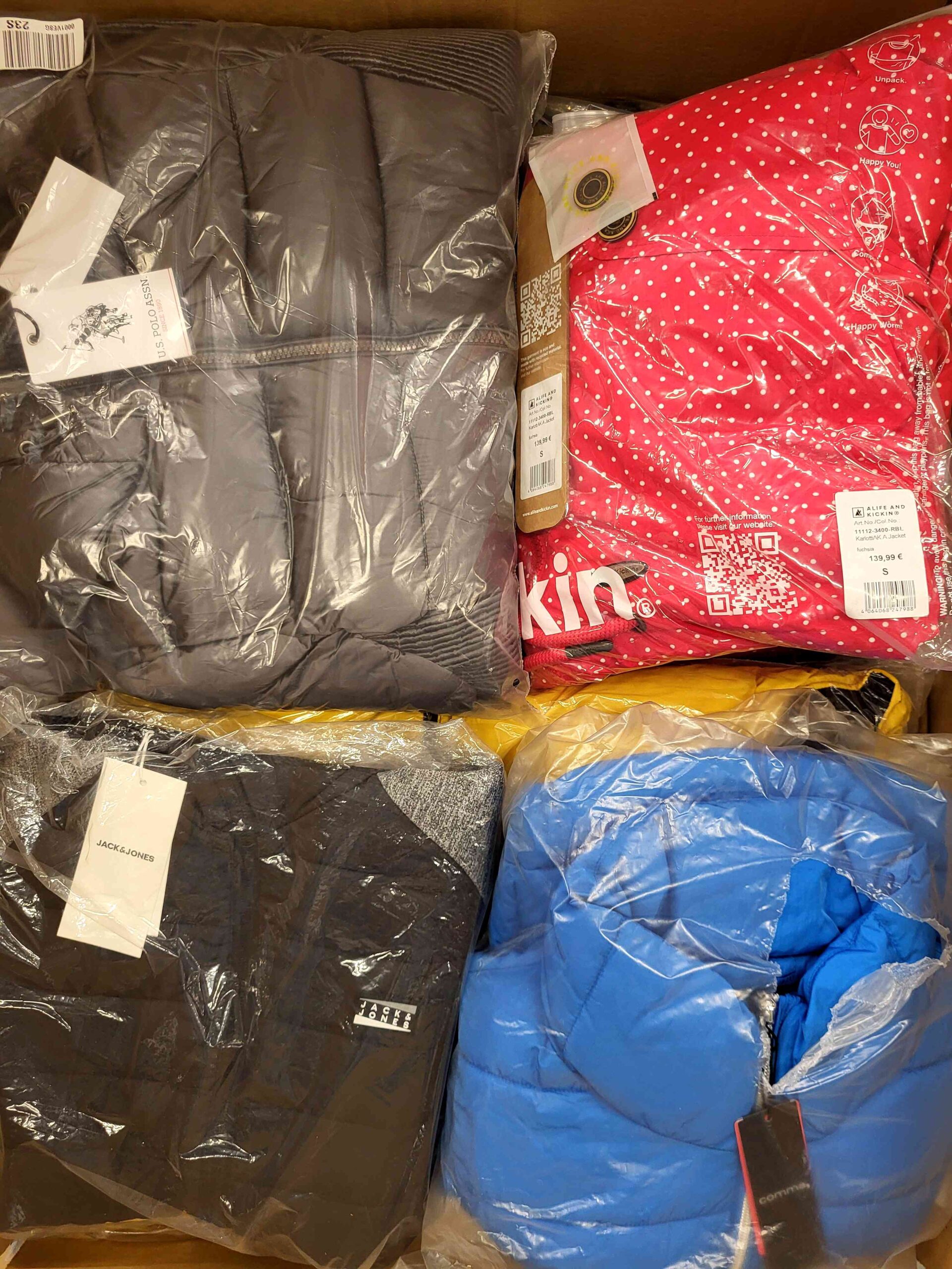 The photo shows a package with clothing in the category AJW.