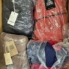 The photo shows a package with clothing in the category AJW.