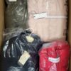 The photo shows a package with clothing in the category AJW.