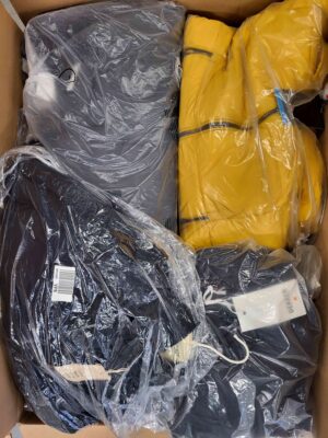 The photo shows a package with clothing in the category AJW.