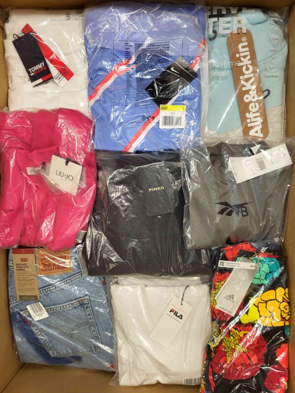 The photo shows a package with clothing in the category AW.