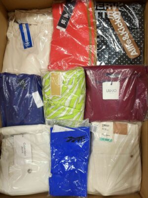 The photo shows a package with clothing in the category AW.