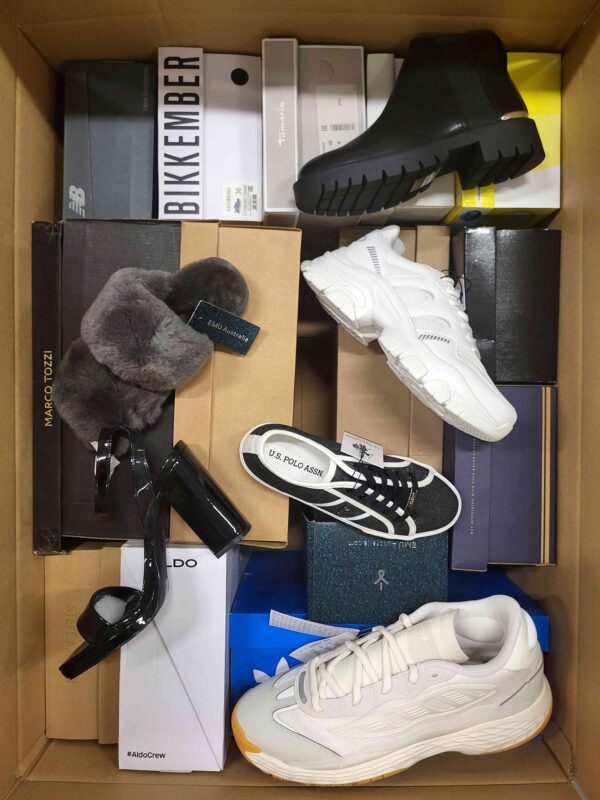 The photo shows a package with footwear in the category AS.
