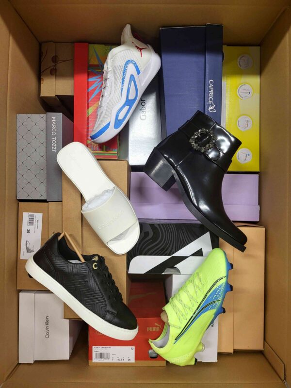The photo shows a package with footwear in the category AS.