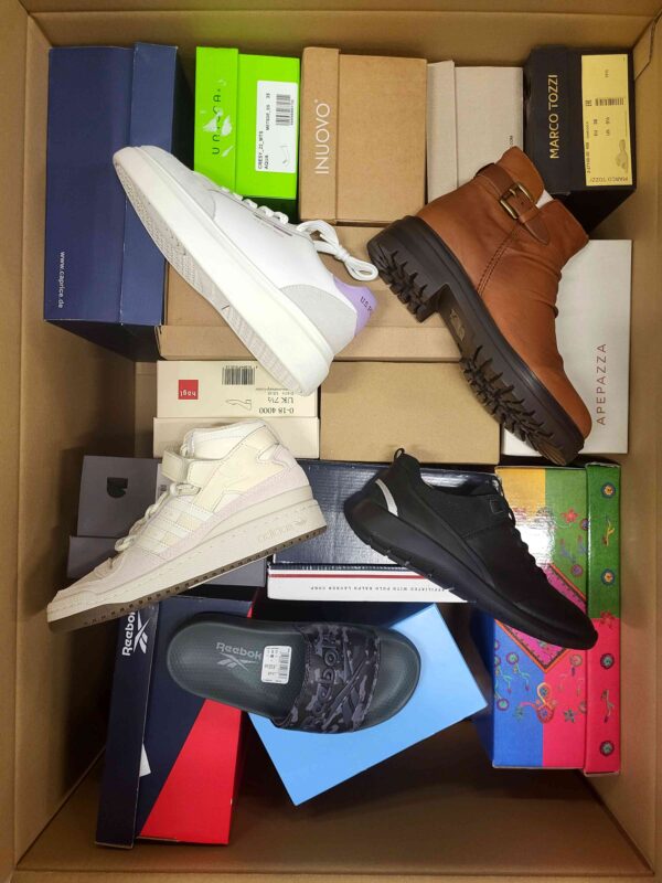 The photo shows a package with footwear in the category AS.