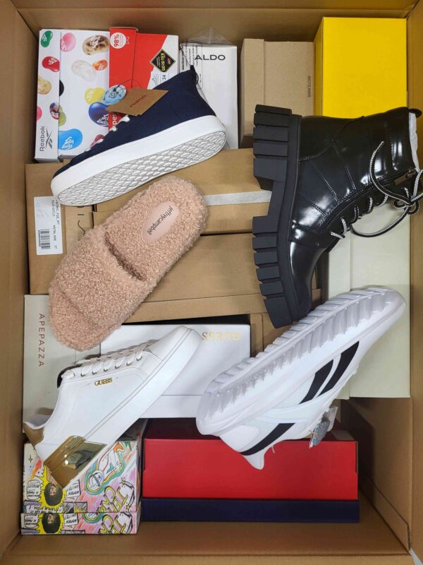 The photo shows a package with footwear in the category AS.