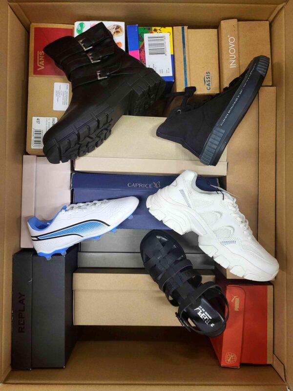 The photo shows a package with footwear in the category AS.