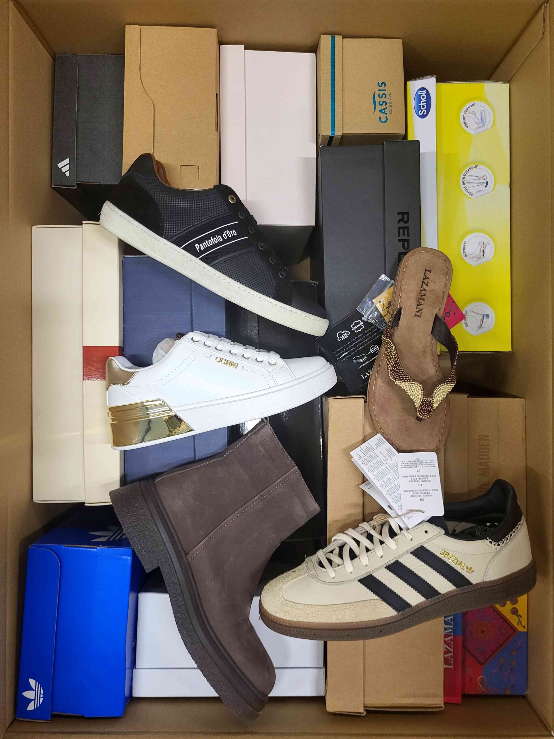 The photo shows a package with footwear in the category AS.