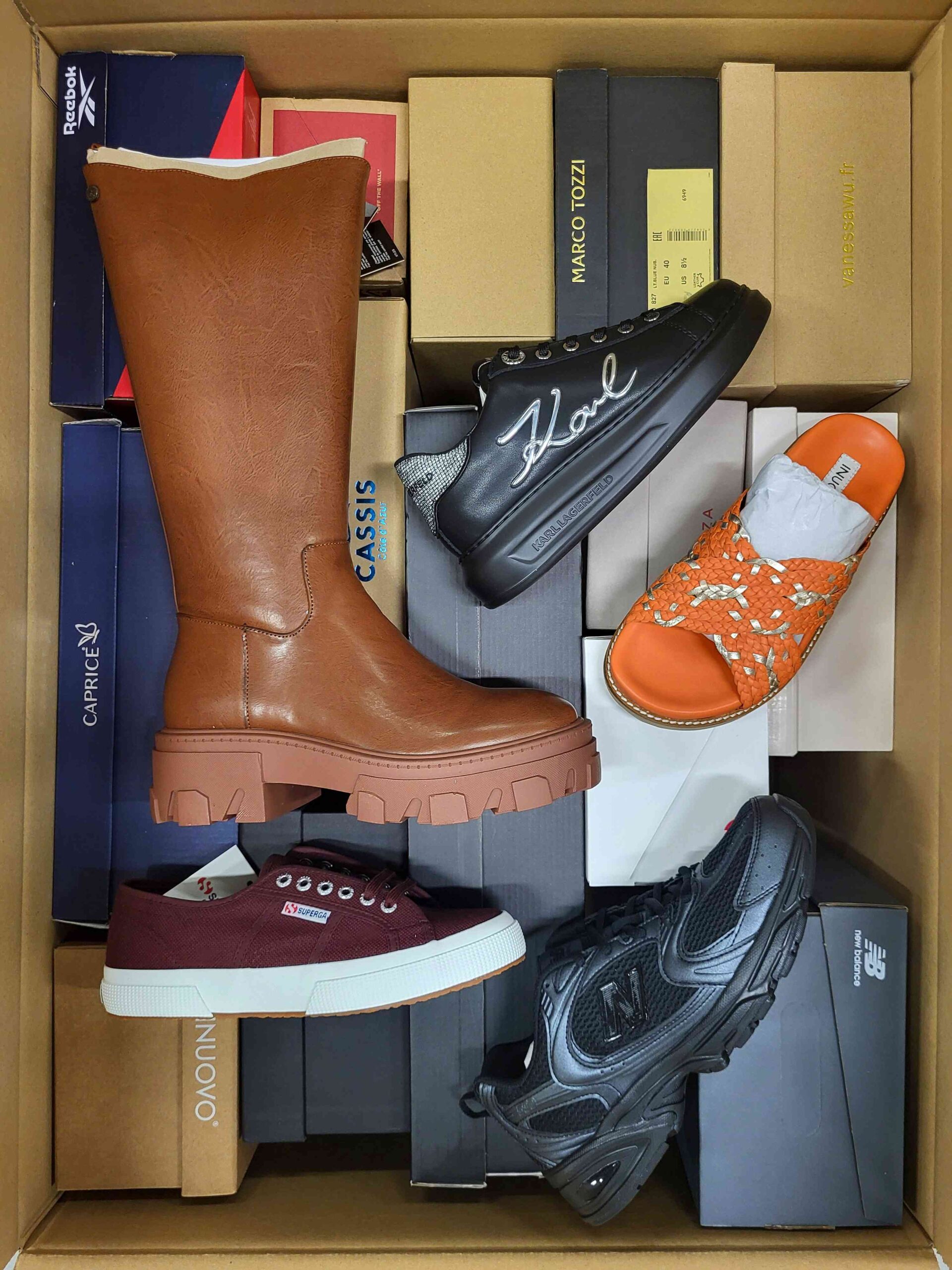 The photo shows a package with footwear in the category AS.