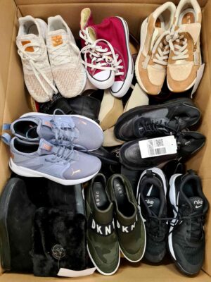 The photo shows a package with footwear in the category SH.