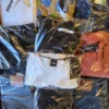 The photo shows a package with clothing in the category C.