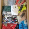 The photo shows a package with clothing in the category AU.