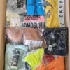 The photo shows a package with clothing in the category AU.
