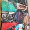 The photo shows a package with clothing in the category AU.