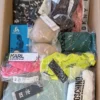The photo shows a package with clothing in the category AU.