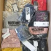 The photo shows a package with clothing in the category AU.