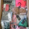 The photo shows a package with clothing in the category AU.