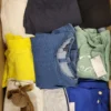 The photo shows a package with clothing in the category TSC.