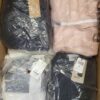 The photo shows a package with clothing in the category AJW.