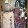 The photo shows a package with clothing in the category AJW.