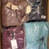 The photo shows a package with clothing in the category AJW.