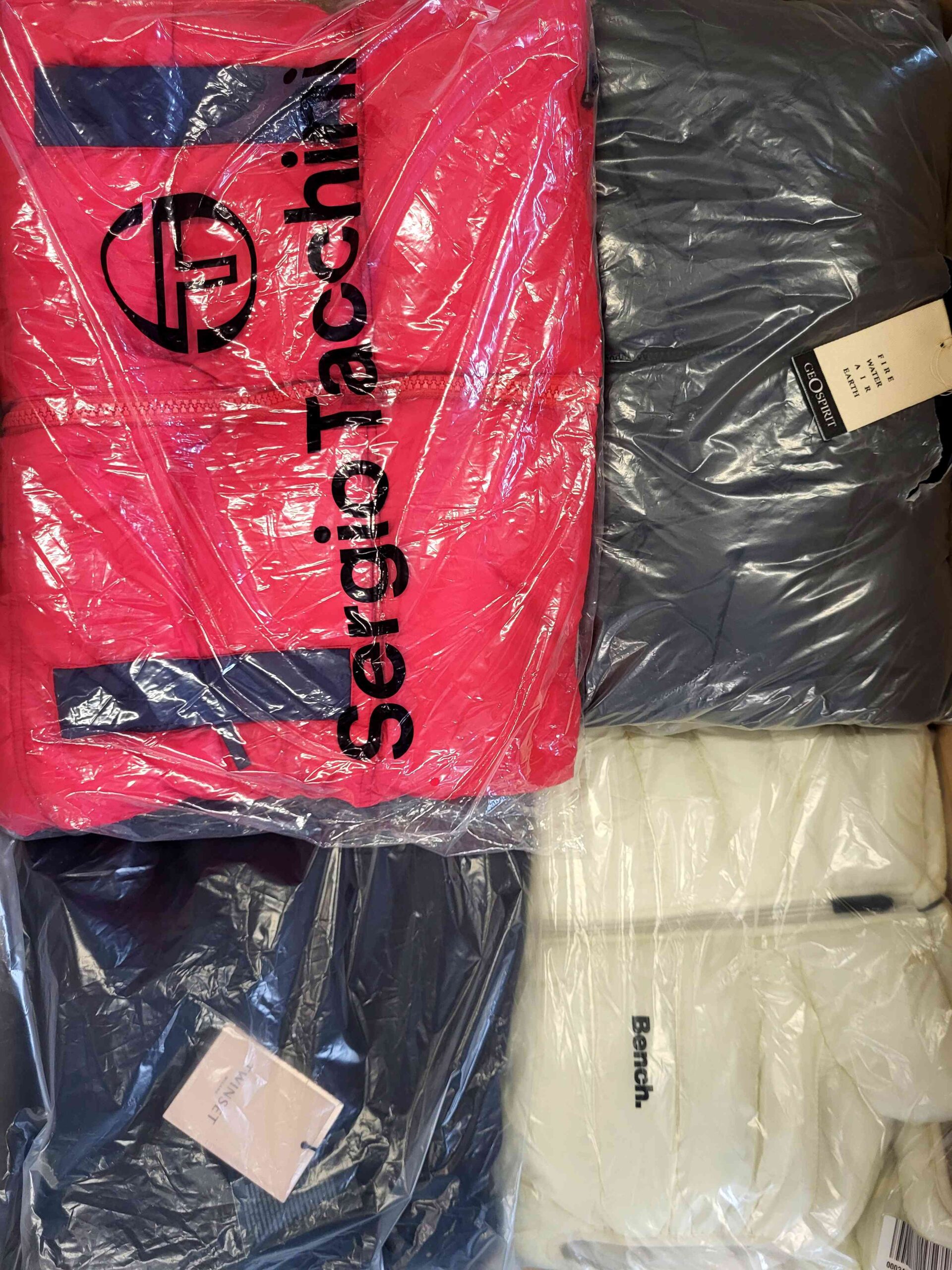 The photo shows a package with clothing in the category AJW.