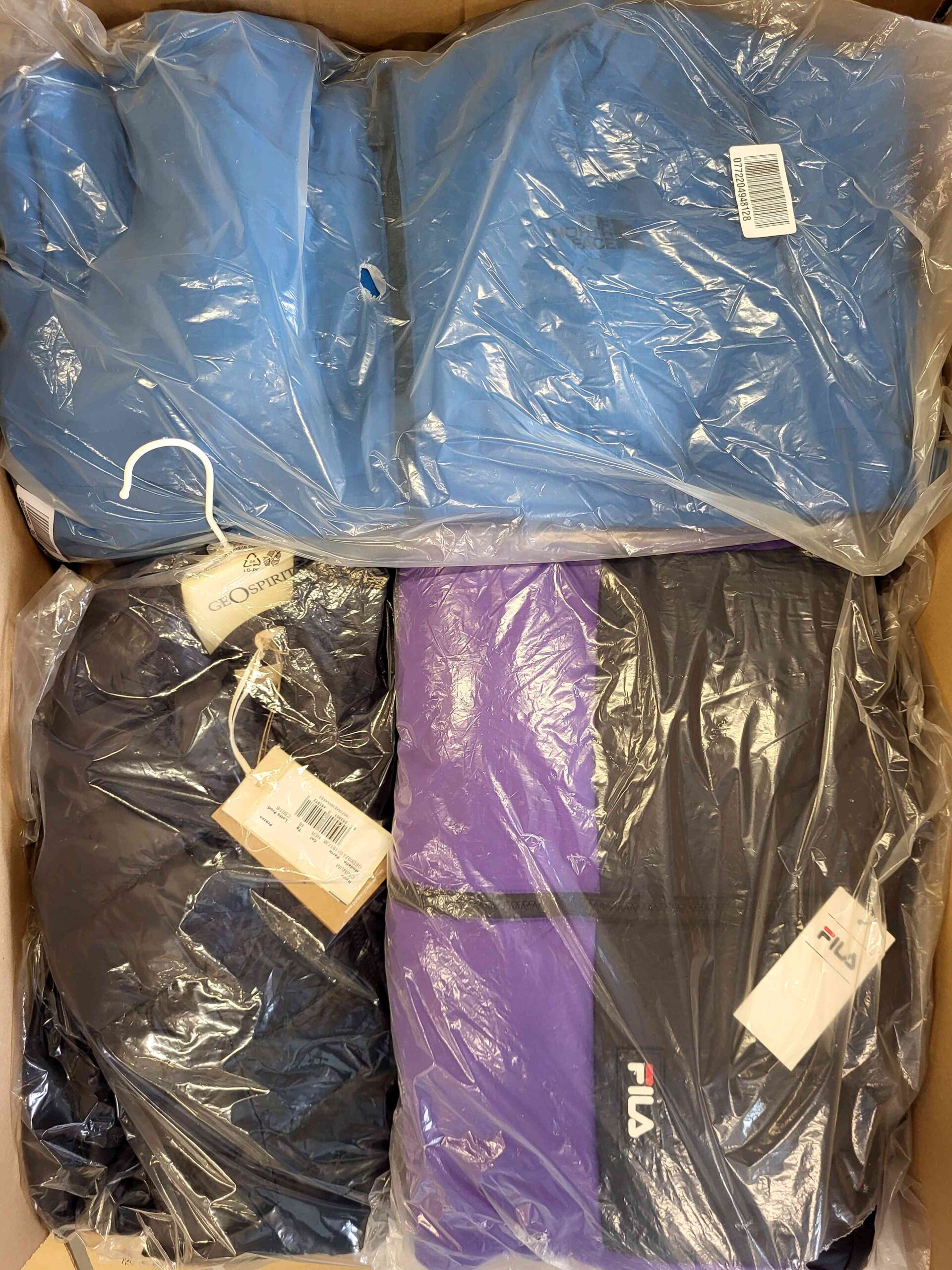 The photo shows a package with clothing in the category AJW.