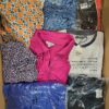 The photo shows a package with clothing in the category BB.
