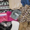 The photo shows a package with clothing in the category SN.