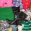 The photo shows a package with clothing in the category SN.