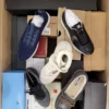 The photo shows a package with footwear in the category AS.
