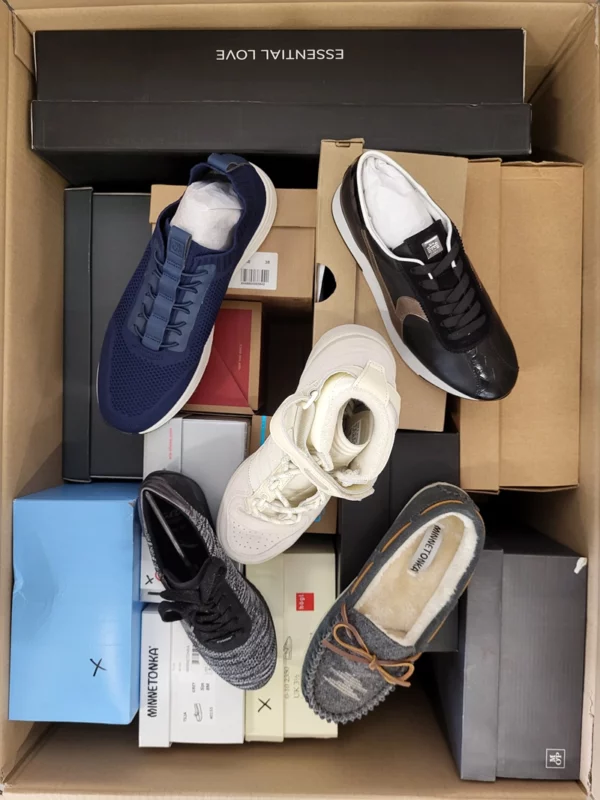 The photo shows a package with footwear in the category AS.