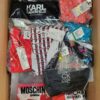The photo shows a package with clothing in the category ABW.
