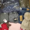The photo shows a package with clothing in the category TSC.