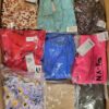 The photo shows a package with clothing in the category AR.
