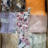 The photo shows a package with clothing in the category AR.