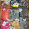 The photo shows a package with clothing in the category AR.