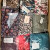 The photo shows a package with clothing in the category AR.