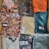 The photo shows a package with clothing in the category AR.