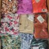 The photo shows a package with clothing in the category AR.