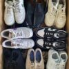 The photo shows a package with footwear in the category SH.