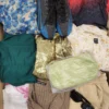 The photo shows a package with clothing in the category SN.