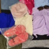 The photo shows a package with clothing in the category SN.