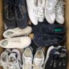 The photo shows a package with footwear in the category SH.