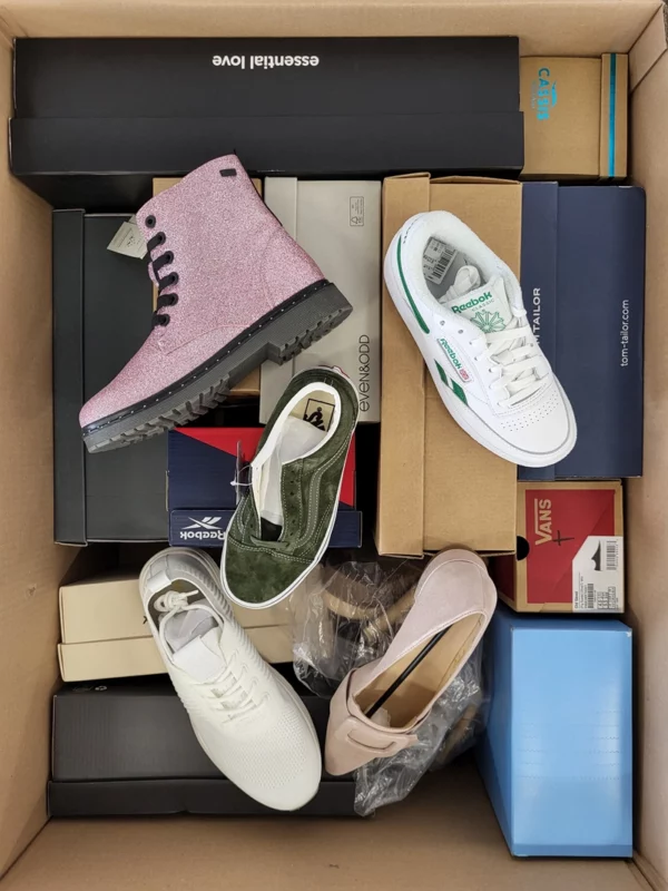 The photo shows a package with footwear in the category AS.