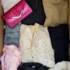 The photo shows a package with clothing in the category BSN.