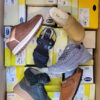 The photo shows a package with footwear in the category SM.