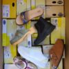 The photo shows a package with footwear in the category SM.
